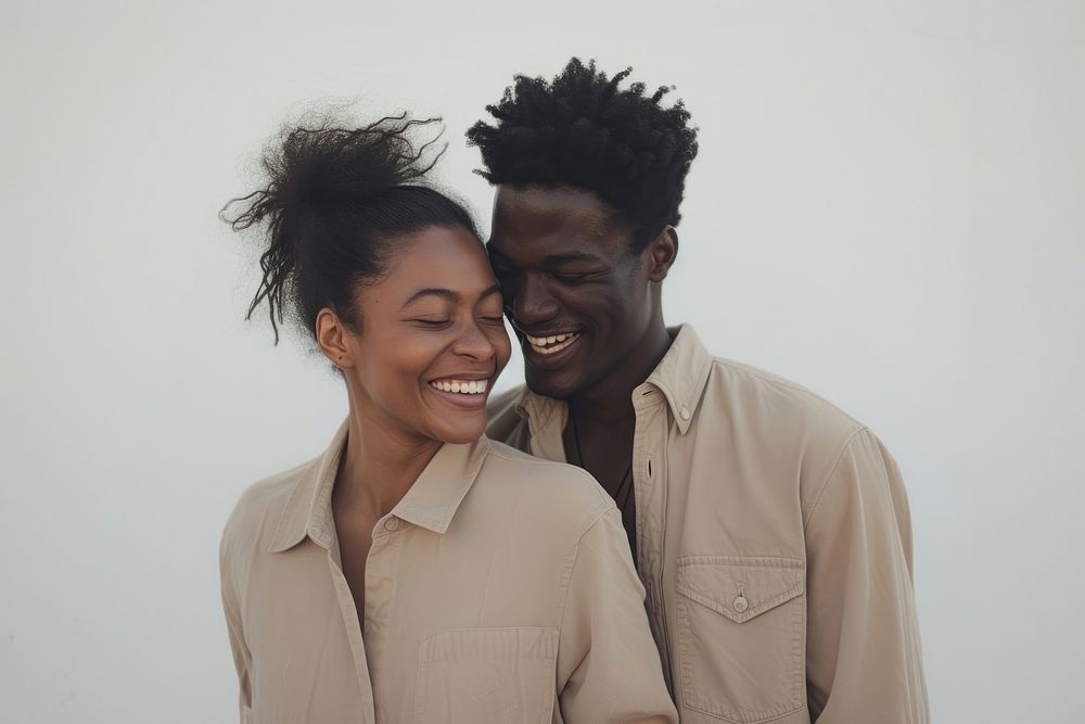 Woman and man standing portrait laughing.