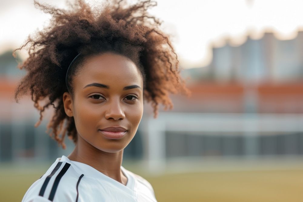 African American women soccer player exercising hairstyle happiness.