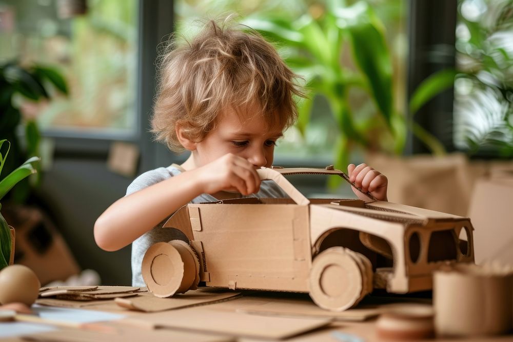 Child Making Cardboard Car child cute car.