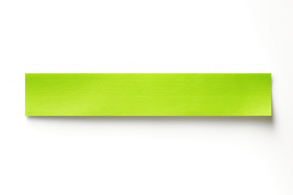 Piece of neon-green paper adhesive strip white background rectangle textured.