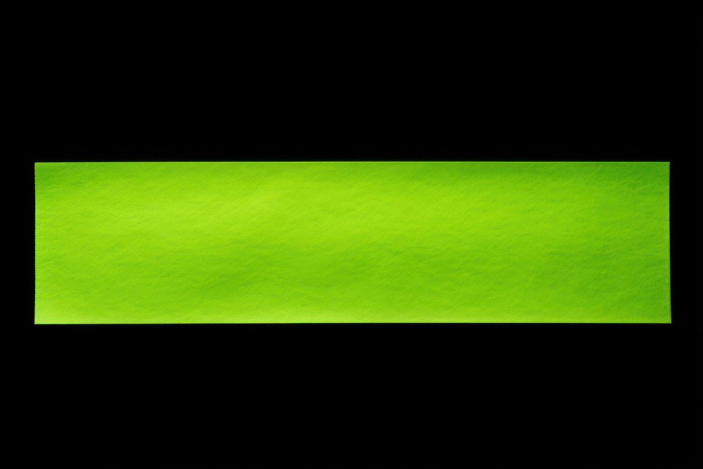 Piece of neon-green paper adhesive strip electronics blackboard rectangle.