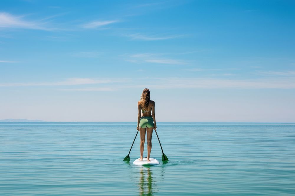 Ocean waves Woman paddle sky.