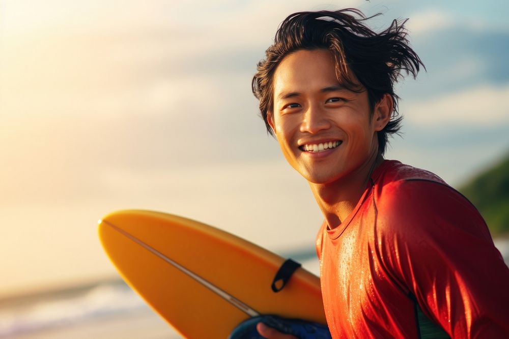 Asian surfer surfing outdoors smiling sports.