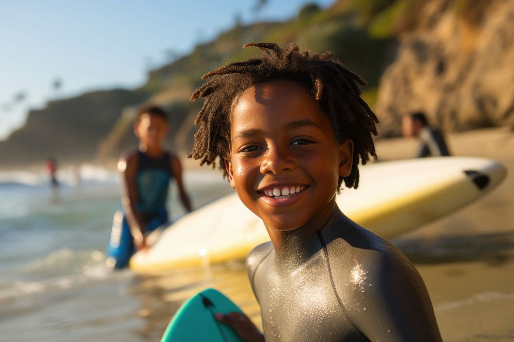 Black boy surfer surfing swimming portrait outdoors.