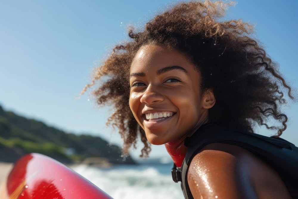 Black girl surfer surfing portrait smiling smile.