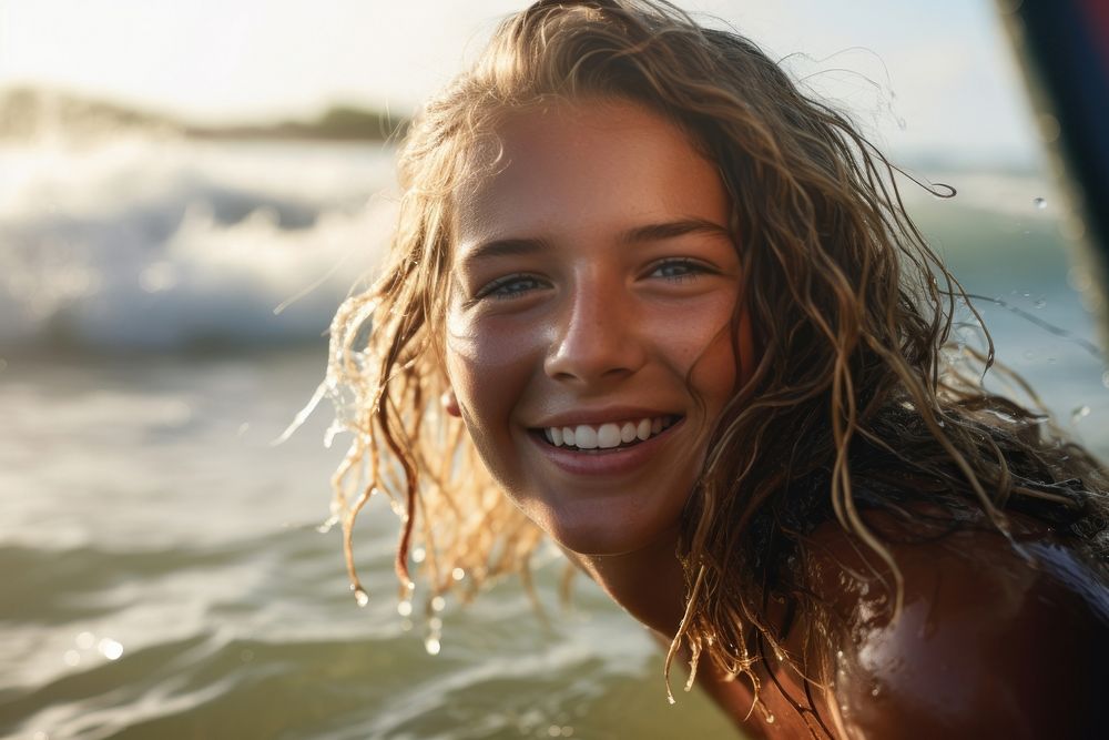 British girl surfer surfing laughing swimming portrait.
