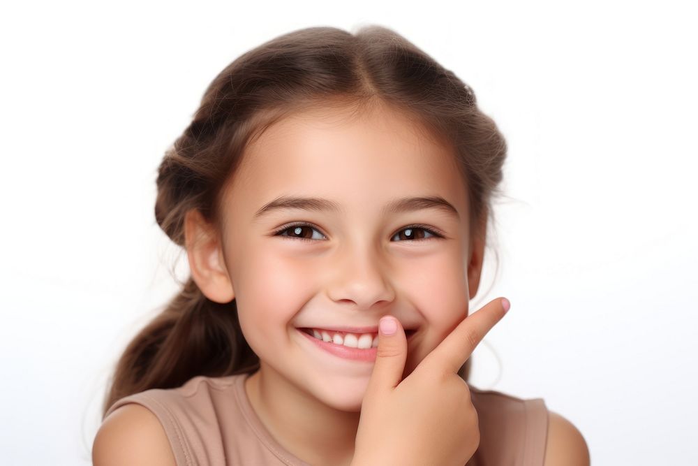 British girl touching face portrait smiling child.