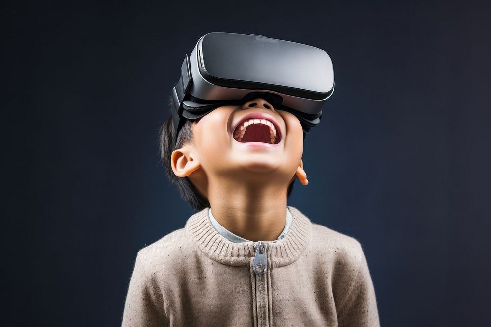 Chinese boy using vr portrait smiling technology.