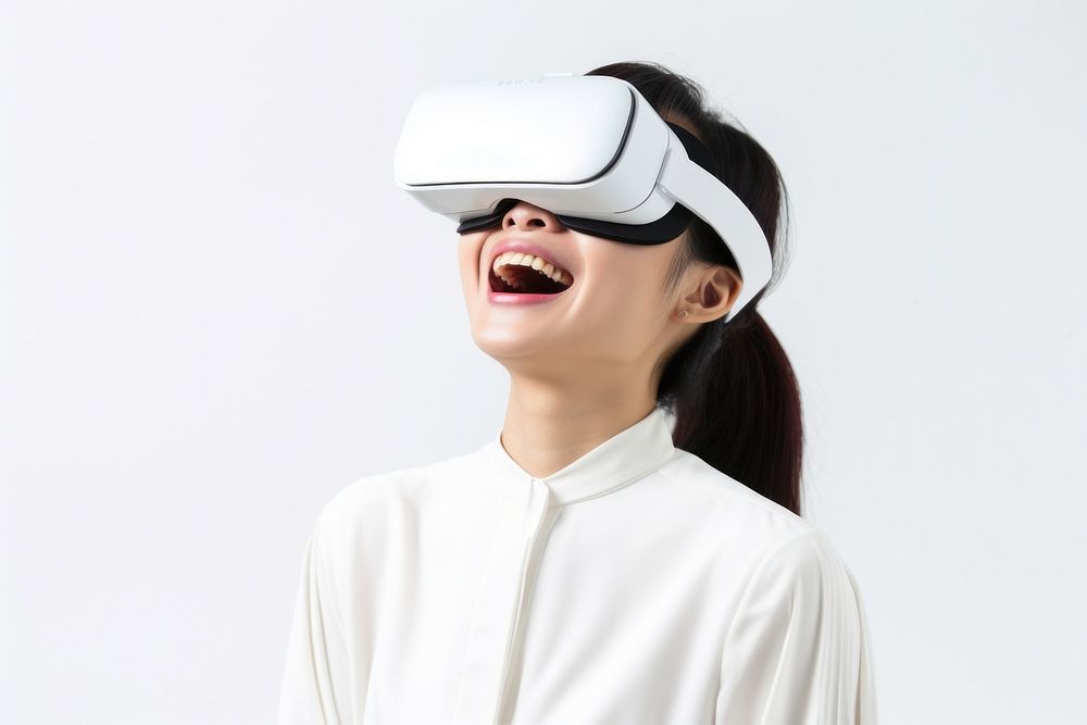Chinese girl using vr portrait smiling white background.