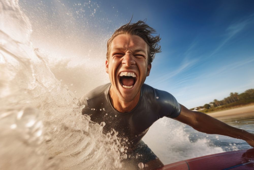 Surfer surfing shouting laughing outdoors.