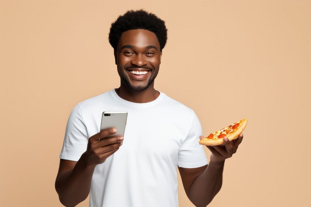 American man in white t-shirt pizza holding adult.
