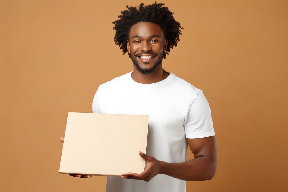 African american man in white t-shirt box holding smile.