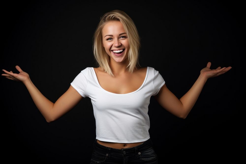 Blonde woman in a white t-shirt laughing smiling smile.