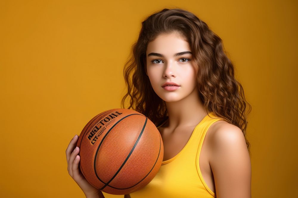 Glad teen basketball girl with ball portrait sports yellow.