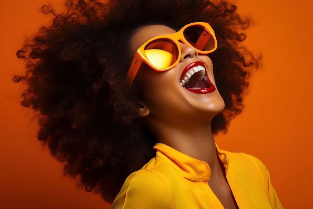 Afroamerican woman sunglasses laughing yellow.