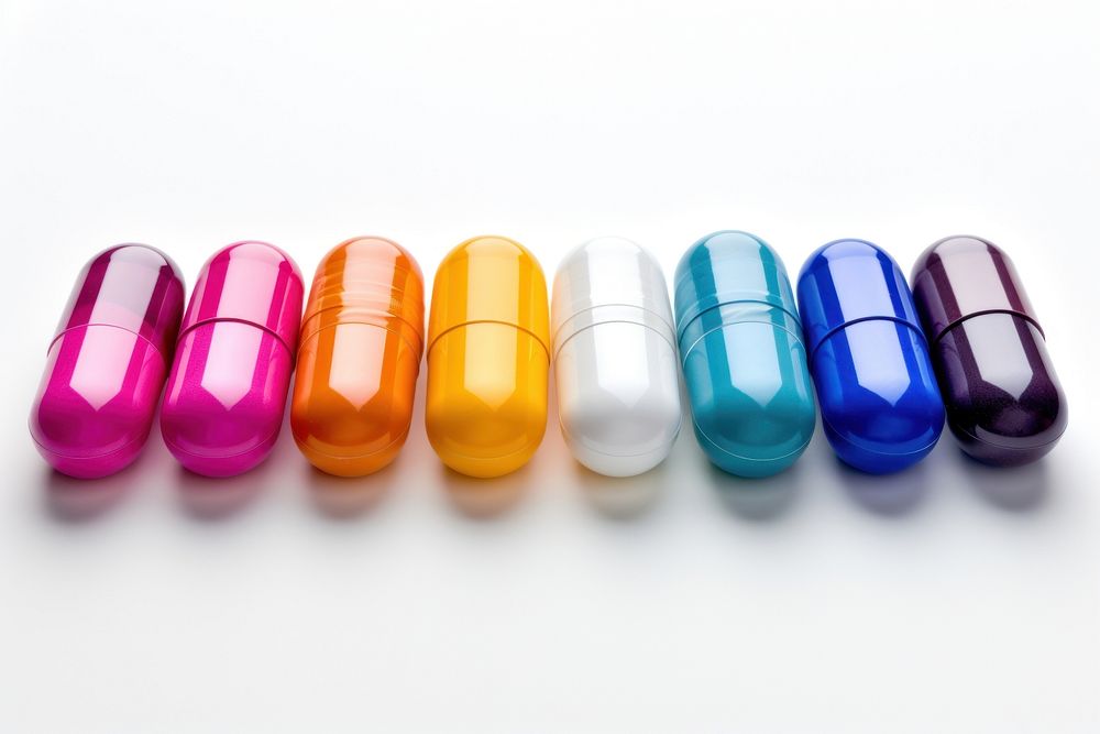 Pill capsules white background medication variation.