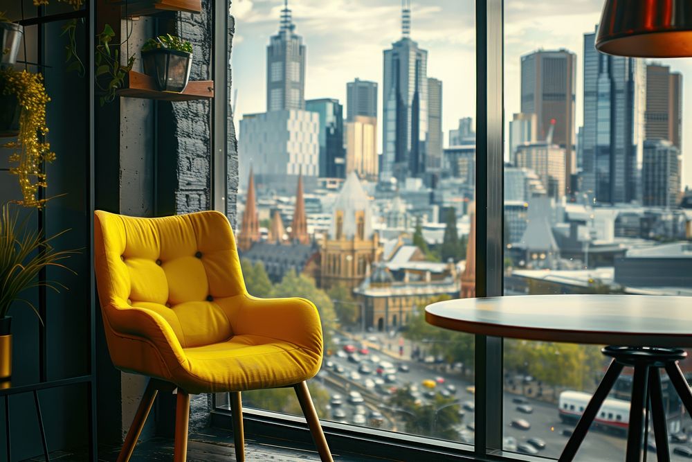Modern cafe restaurant interior with yellow chair against window with city view architecture furniture cityscape.