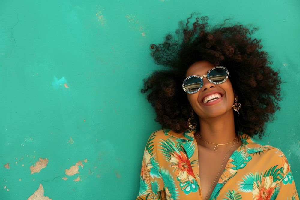 African woman sunglasses laughing cheerful.
