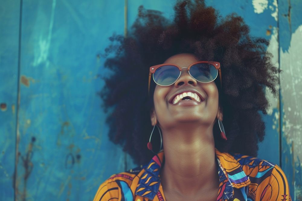 African woman sunglasses cheerful laughing.