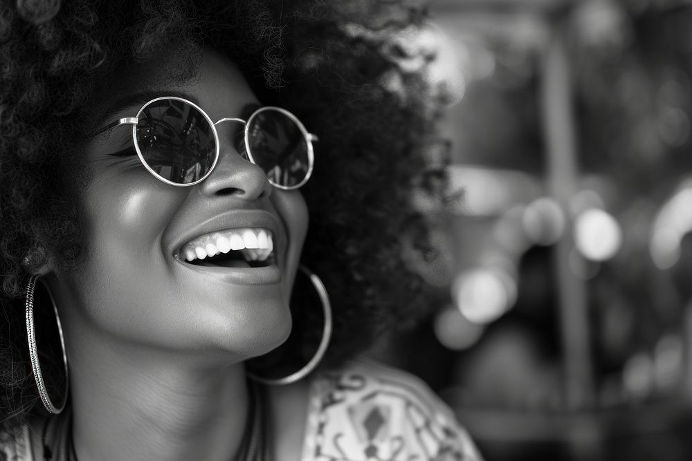 African woman sunglasses cheerful portrait.
