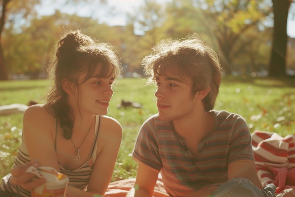 Couple of happy young american adult picnic photography portrait outdoors.
