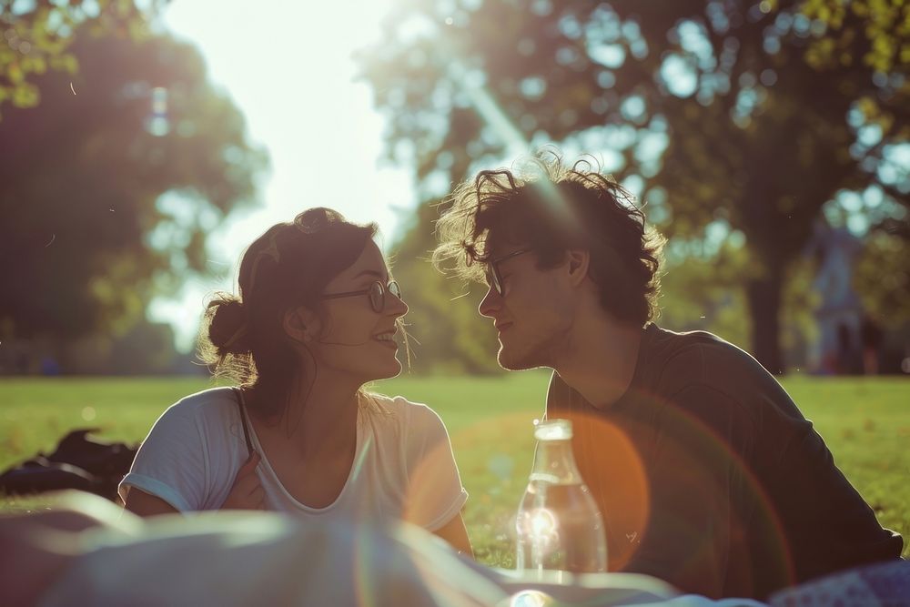 Couple of happy young adult picnic photography portrait outdoors.