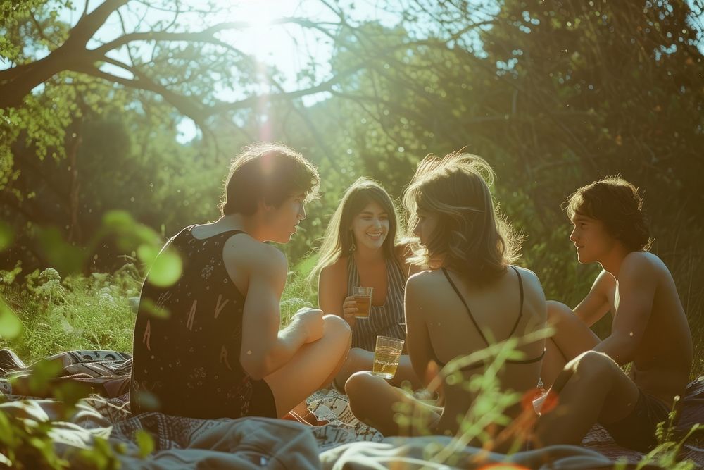 Group of happy young adult picnic photography sunlight outdoors.