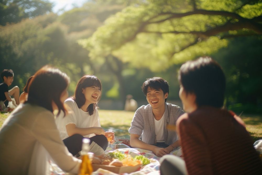 Group of happy young japanese adult picnic fun togetherness celebration.