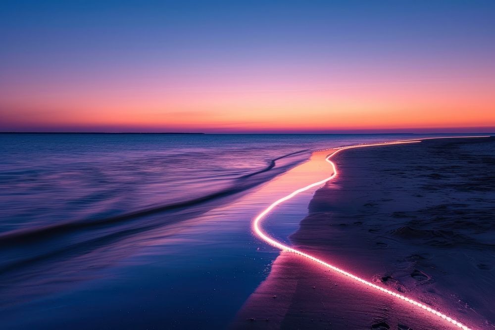 Light line painting at the sea during sunset outdoors horizon nature.