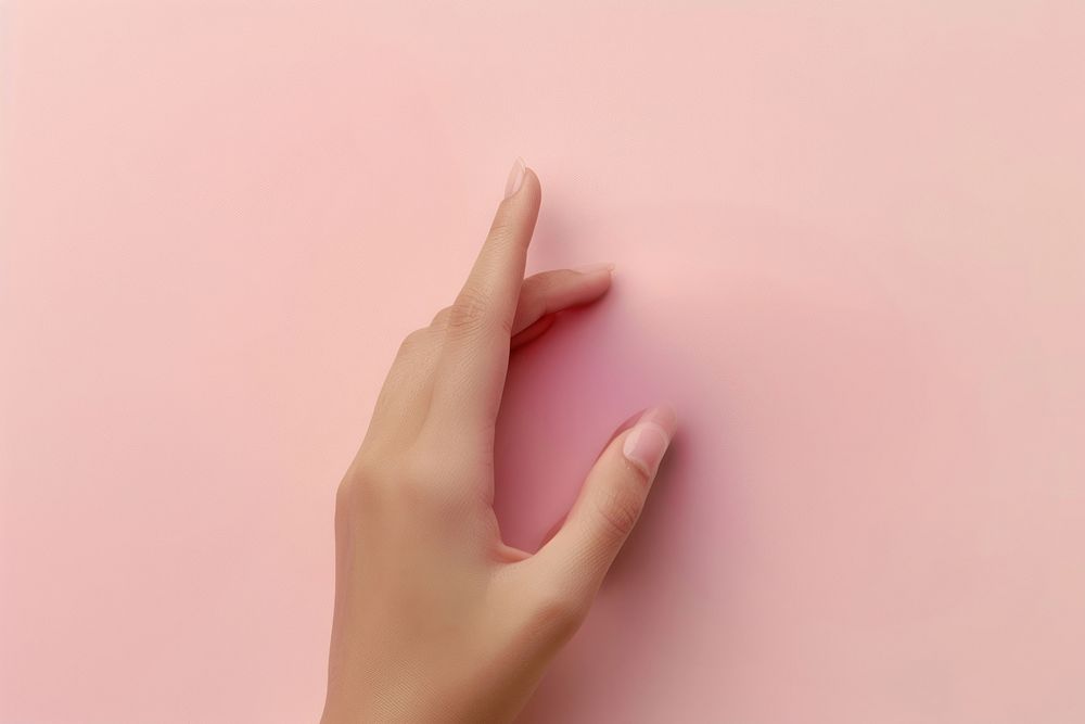 Person hand finger pink gesturing.