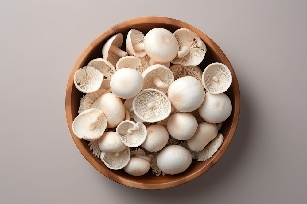 Pile white mushrooms wood ingredient container.