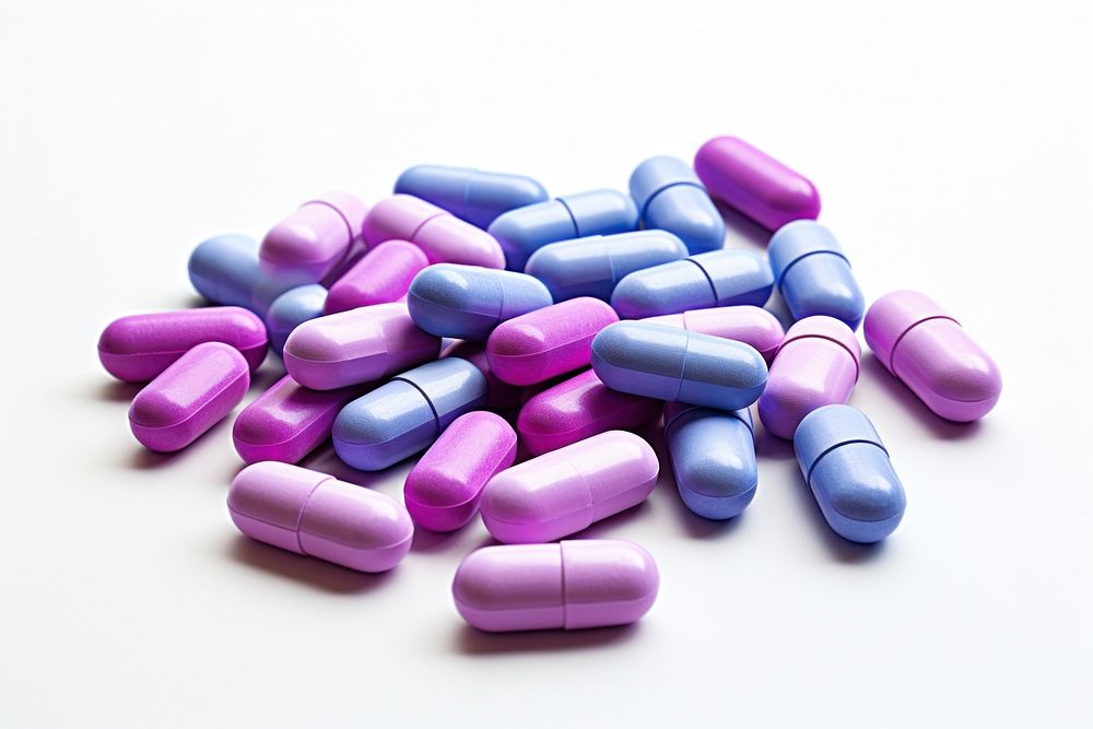 Pill capsules white background antioxidant medication.
