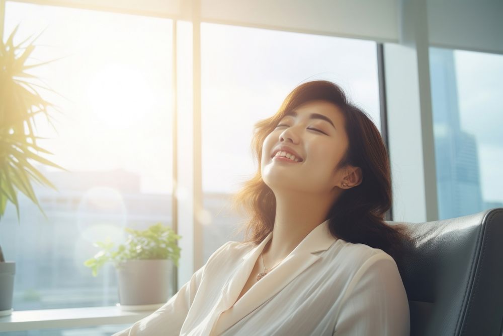 A lady enjoy working in the office bright light environment advertisment style smile adult contemplation.