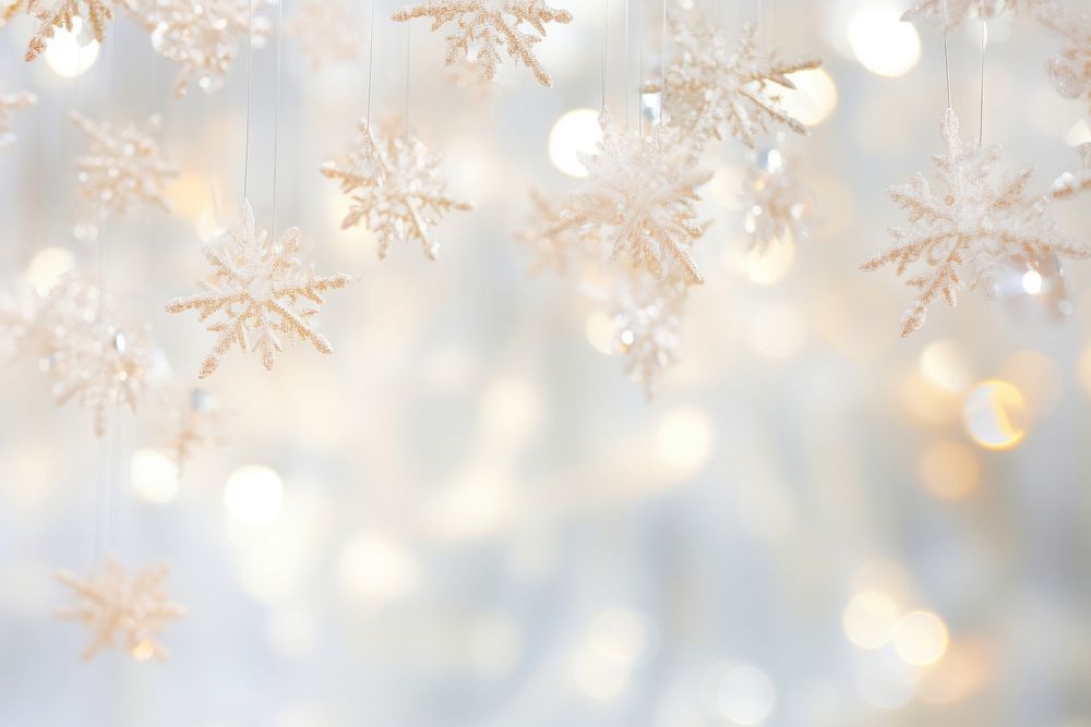 Elegant snowflakes suspended from a luminous bright light white background backgrounds illuminated celebration.