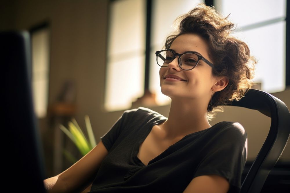 A lady enjoy working in the office bright light environment advertisment style portrait glasses adult.