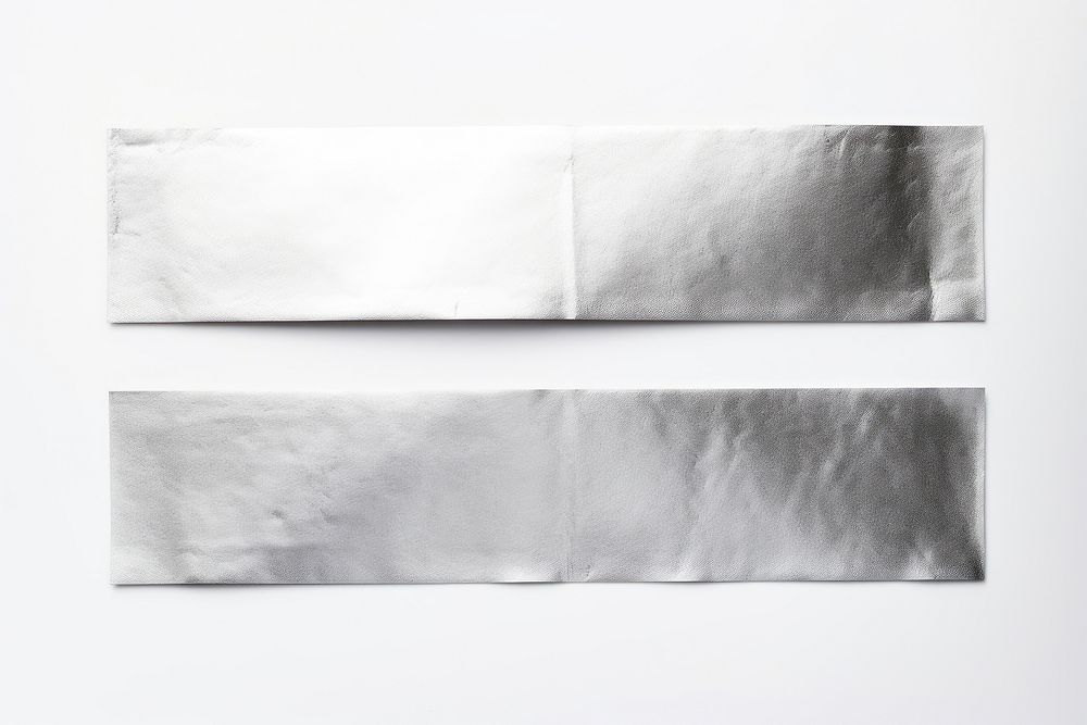 Foil teature adhesive strip white paper white background.
