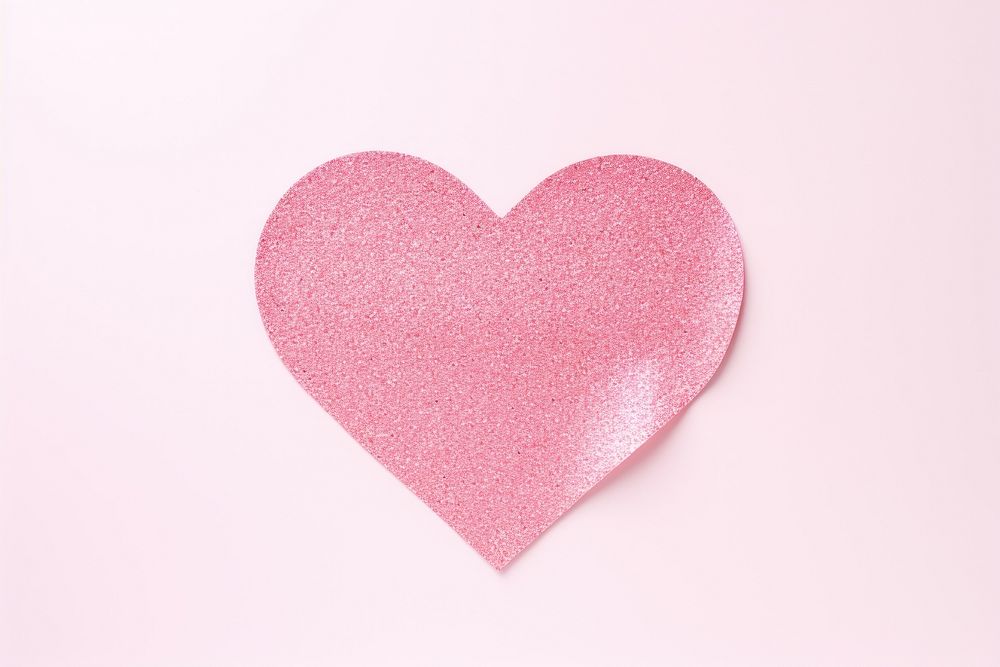 Heart pink glitter paper white background celebration pattern.