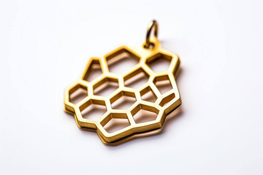 Gold honeycomb charm pendant white background accessories.