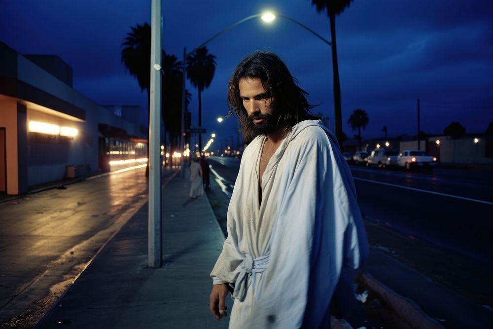 Jesus Chris walking in California street night photography portrait.