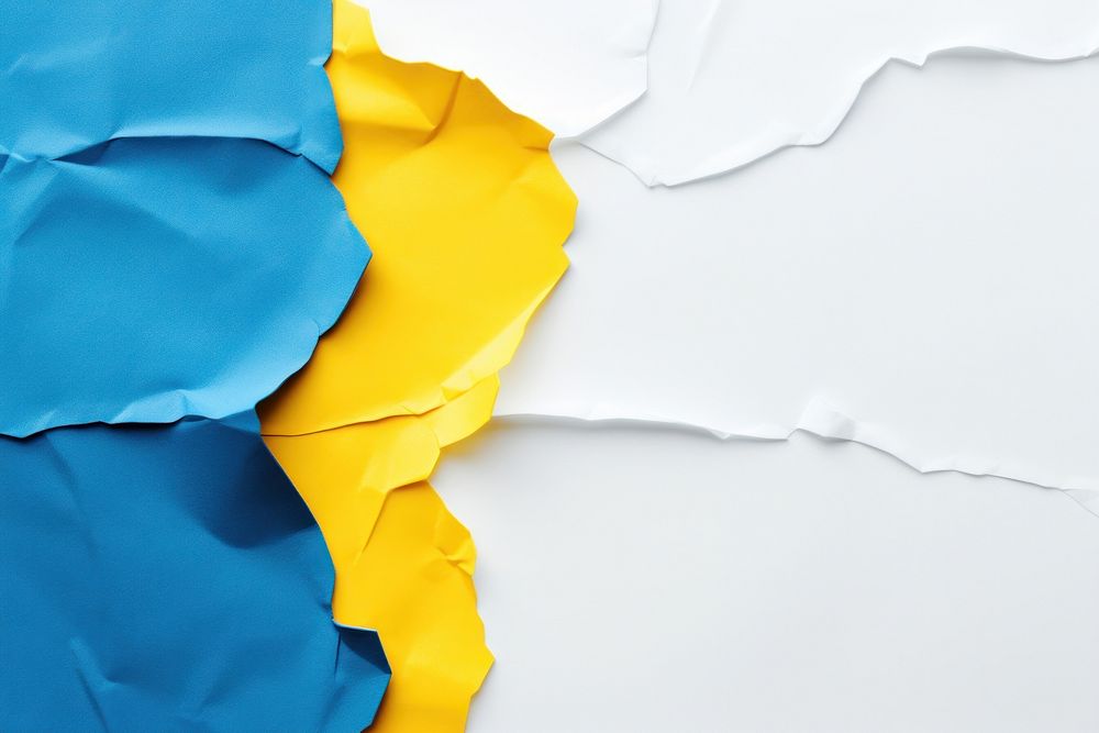 Torn strip of blue and yellow paper backgrounds petal textured.