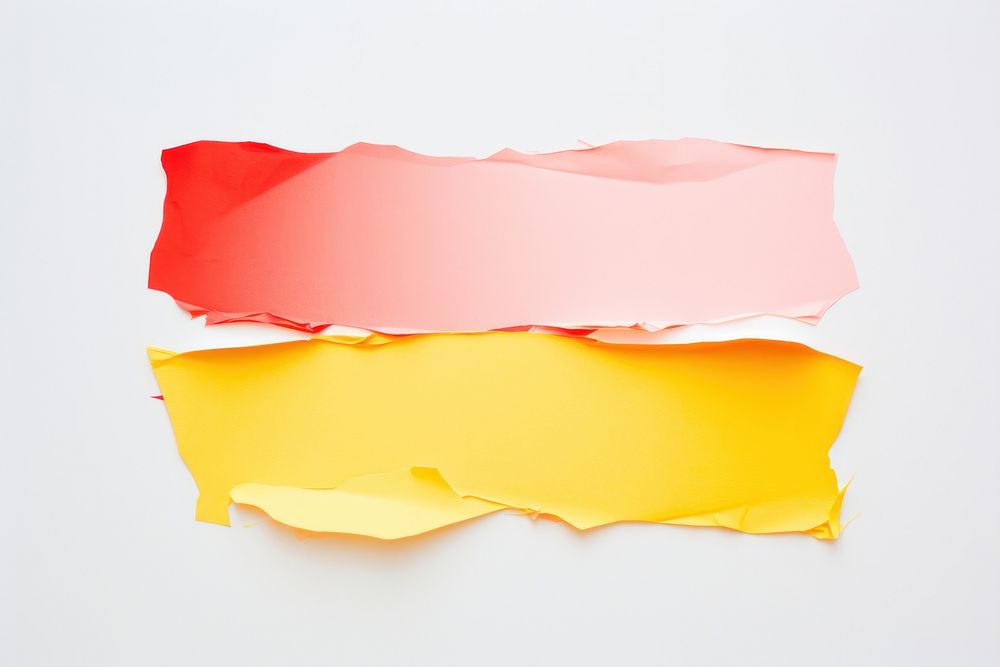 Torn strip of pastel red and yellow paper backgrounds petal white background.