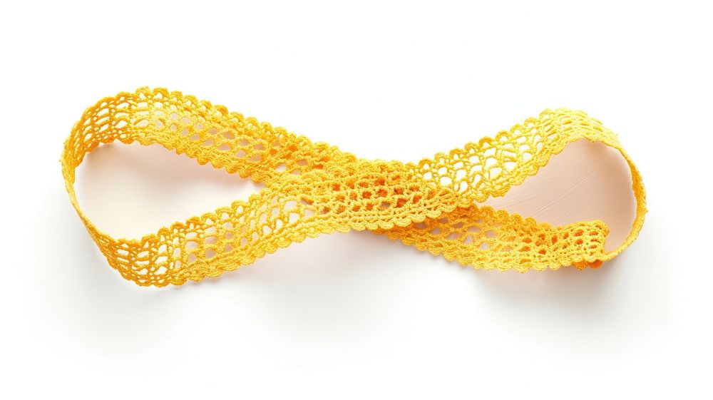 Yellow crochet lace tape adhesive strip jewelry white background bling-bling.