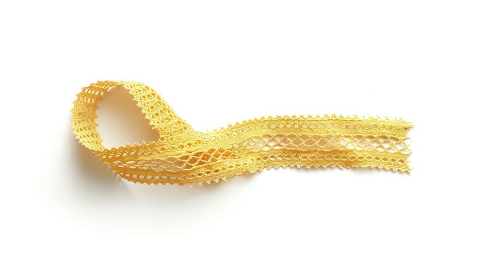 Yellow crochet lace tape adhesive strip jewelry gold white background.