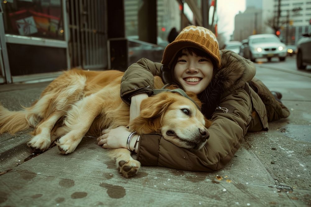 Person hugging a dog pet portrait smiling.