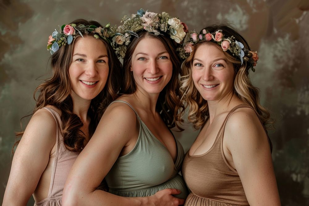 3 happy pregnant women having a photoshoot in a studio portrait wedding adult.