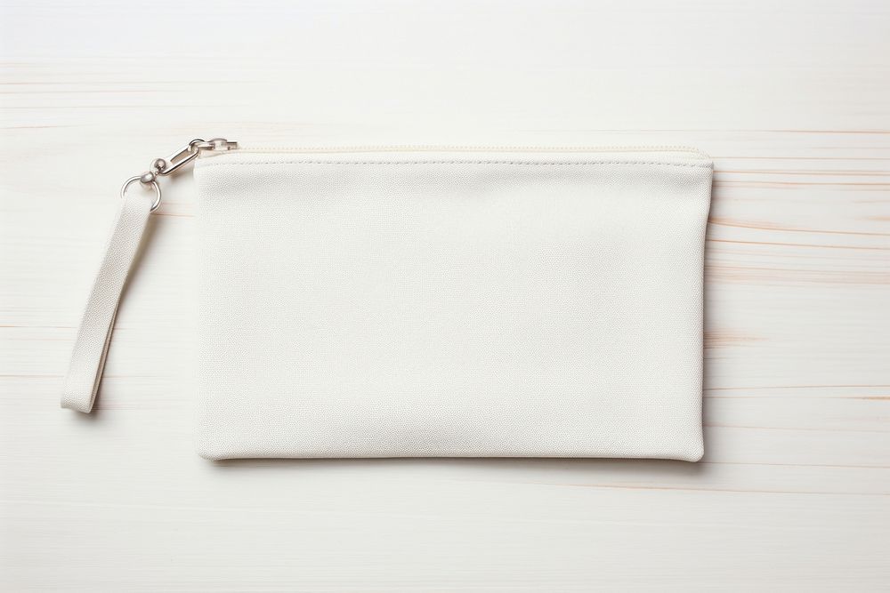 White cotton wristlet handbag white background accessories.