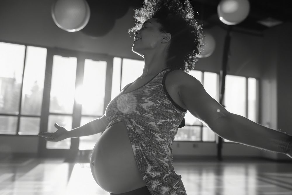Happy pregnant woman working out dancing sports adult.