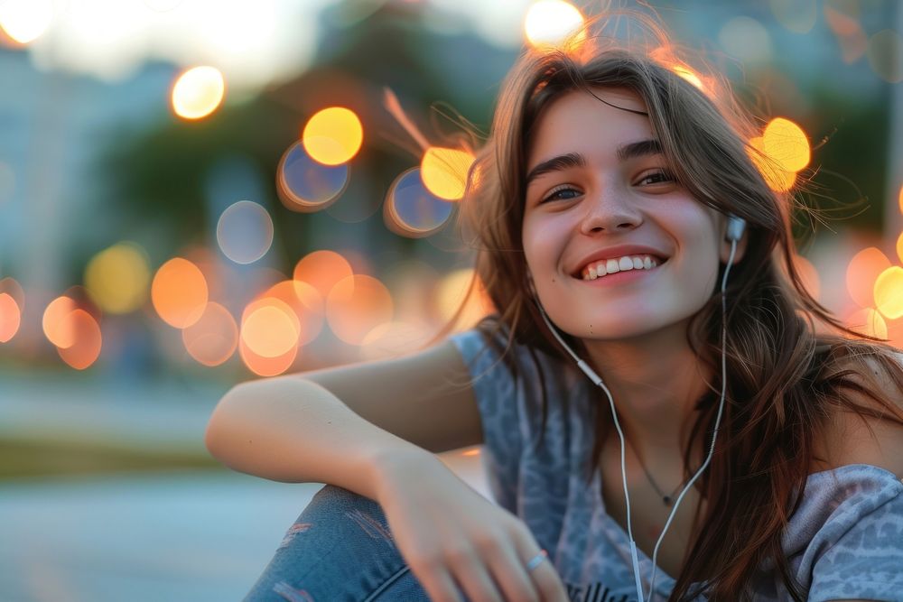 Young happy female listening outdoors smile.