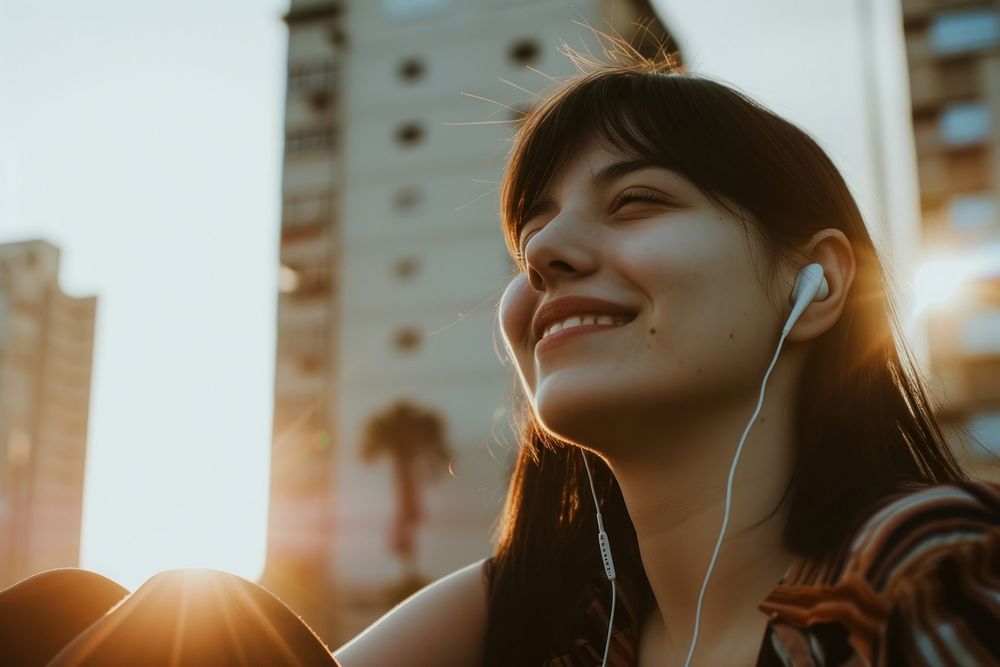 Young happy female listening music adult.