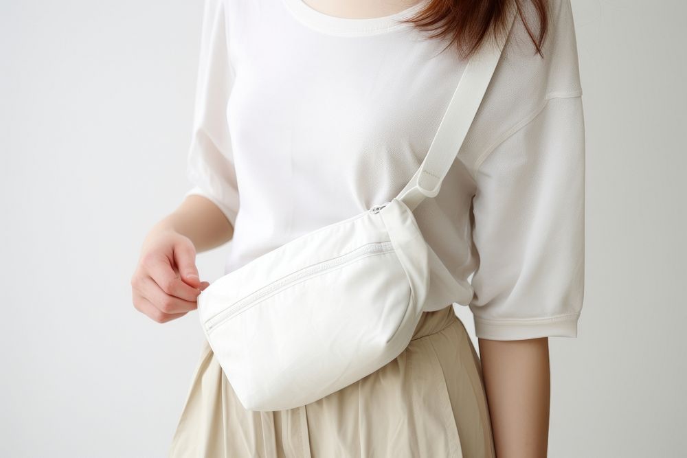 Woman carry nylon white crossbody bagwhite handbag adult white background.